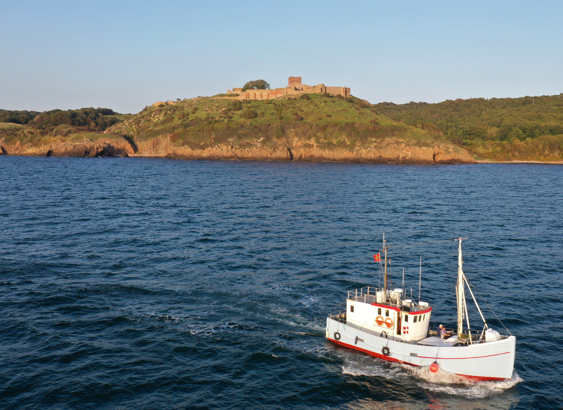 Cruising along the Bornholm coastline in the sunset